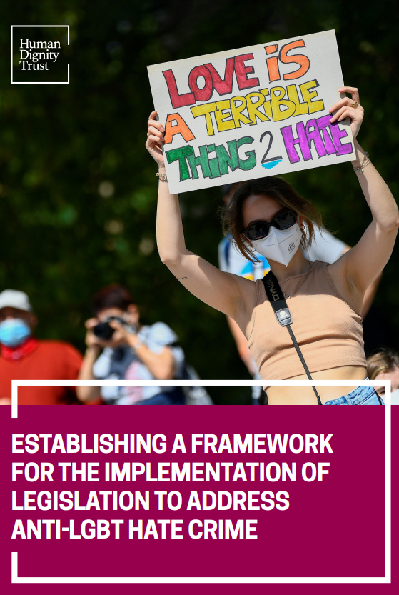 Screenshot showing the cover page of the resource, including the human dignity trust logo, title and person holding up a ‘love is a terrible thing to hate’ poster. 